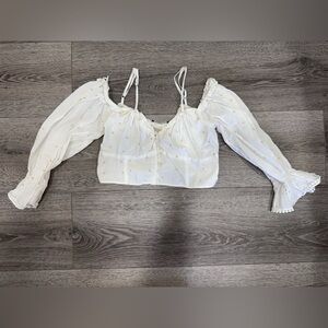 White blouse with little yellow dots
From:ZARA